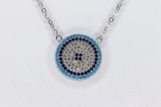 Sterling silver evil eye blue and white cubic zirconia necklace. 17 inch length +1 inch extender total of 18 inch necklace The evil eye is a talisman that is meant to protect you from these evil spirits. The evil eye is a 'look' or 'stare' believed to bring bad luck for the person at whom it is directed. A modern piece of everyday appearance but also it is a unique gift for your special ones. (bridesmaid gift, birthday gift, ) as protection from bad eyes.  Stones: Blue and White  Cubic Zirconia Blue Evil Eye Necklace, Evil Eye Blue, Zirconia Necklace, Heirlooms Jewelry, Cubic Zirconia Necklace, Bad Luck, Blue Evil Eye, Wedding Jewellery Necklace, Evil Eye Necklace