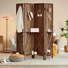 a room divider in the middle of a living room with furniture and accessories on it