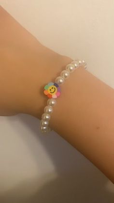 Rainbow smiley face flower bracelet! Made with care and looks awesome with any outfit! Cute Flower Bracelets For Spring, Casual White Flower Bracelets, Casual White Flower Bracelet, Trendy Beaded Bracelets With Flower Charm, Trendy Beaded Bracelet With Flower Charm, Fun White Flower-shaped Jewelry, Trendy Flower Bracelets For Friendship, Everyday Beaded Bracelets, Cute Beaded Bracelets With Flower Charm