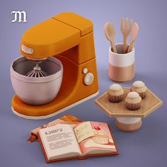 an orange mixer and some cupcakes on a table next to a cookbook