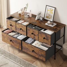 a wooden dresser with drawers and pictures on it