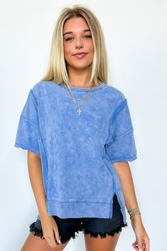 Details: Introducing our Raw Edge Washed Top! Made from a soft and lightweight knit fabric, this top features a round neckline, drop shoulders, and short sleeves for a casual and oversized fit. Perfect for a laid-back look, the raw edge finish adds a touch of edginess to this washed top. - Short sleeves - Relaxed fit - Round neck Content: 100% CottonSize + Fit: Model is 5'8" and wearing a Small - Approximate measurements from a size small - Full length: 23” - Chest: 46” - Waist: 44” - Sleeves: 1 Cheap Washed Blue Relaxed Fit Top, Cheap Medium Wash Top With Frayed Hem, Cheap Dark Wash Denim Top With Short Sleeves, Cheap Medium Wash Cotton Top, Cheap Faded Soft-washed Tops, Cheap Washed Light Indigo Tops, Cheap Crew Neck Tops With Frayed Hem, Cheap Garment Washed Summer Top, Cheap Relaxed Fit Dark Wash Tops