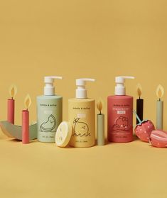 several different types of hand soaps on a yellow background