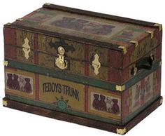 an old trunk with teddy's trunk labels on the front and sides, sitting upright