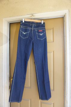 "This is a great pair of vintage Rene De France jeans. The Jeans have great contrasting stitching that really stands out against the blue denim and uniquely shaped backside. Labeled size 32 - 11 - please see measurements. Measurements taken across front laid flat Size Marked: 32 - 11 Waist: 14.5\" Hips: 20\" Inseam: 34\" Rise: 11\"" High Rise Blue Flare Jeans With Contrast Stitching, Fitted Dark Wash Flare Jeans With Contrast Stitching, Fitted Dark Wash Pants With Contrast Stitching, Fitted Retro Denim Flare Jeans, Fitted Retro Flare Denim Jeans, Fitted Denim Blue Pants With Contrast Stitching, Retro Fitted Dark Wash Flare Jeans, Retro High Waist Dark Wash Pants, Medium Wash Retro Fitted Jeans