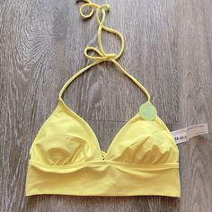 Nwt Forever 21 Strappy Yellow Bikini Top Super Cute And Perfect For A Day At The Beach Or Tanning By The Pool! Brand New Hasn’t Been Worn Size Small Has Removable Cups. Reasonable Offers Are Welcomed :) Much More Swimwear In My Shop Too! Looks Great With A Pair Of Printed Bottoms Or Plain Black And White Ones. Love The Back So Much! Very Flattering On. Fits A B-C Cup Best #Swim #Costal #Abercrombie #Frankiesbikinis Trendy Triangle Top Tankini For Beach Party, Spring Triangle Halter Top For Poolside, Triangle Crop Top For Poolside Spring, Triangle Top Crop Top For Poolside Spring, Spring Tankini With Bra Friendly Triangle Top, Fitted Triangle Crop Top For Poolside, Fitted Triangle Top Crop Top For Poolside, Spring Triangle Crop Top For Poolside, Trendy Halter Top For Poolside Spring