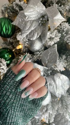 #nails #acrylics #aesthetic #girls #nailinspiration #inspiration #prettylittlething #fashion #girlboss naildesigns #nailart #nailideas #designs #nailpics #acrylicdesigns #frenchtips #manicure #frenchmanicure #christmas #christmasnails #snowflakes #snowflakenails #christmasnailinspo #christmasnailideas #winternails #winter #wintersnowflake #snowy Light Green Christmas Nails, Almond Holiday Nails, Christmas Nails Acrylic Almond, Acrylics Aesthetic, Vogue Nails, Aqua Nails, Classy Nail, Classy Nail Designs