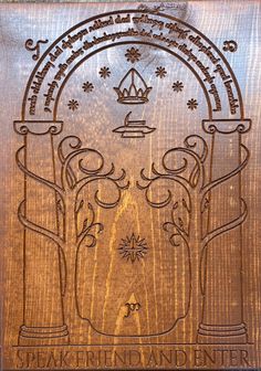 a wooden plaque with an image of a tree