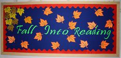 a sign that says fall into reading with leaves painted on the front and back of it