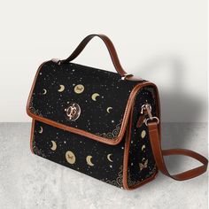 "Cottagecore Celestial Canvas Satchel bag, Kawaii Witch Moon Phases Crossed body vegan leather strap hand bag, goth bag, hippies boho gift >>PRODUCT INFO<< * 18.94 Oz. Made from high-grade waterproof canvas, durable, water-resistant. * Can be used as a nice laptop storage bag, business briefcase, college school bag, leisure travel tote bag, crossbody messenger bag, card wallet case, etc. * Two interior pockets for small items one zipper pocket. * Removable and adjustable shoulder strap. * The sh Things To Buy For High School, Small Satchel Bag, Gifts For Goths, Black Bohemian Shoulder Bag With Detachable Strap, Gifts For Hippies, Witch Moon Phases, Cottagecore Items, Goth Bags, Cute Messenger Bag