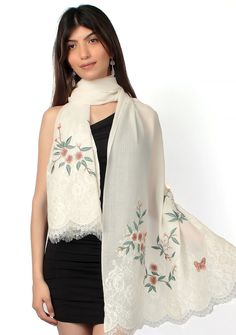 Indulge in the timeless allure and purity of our ivory cashmere scarf. Its delicate multi-colored floral embroidery combined with tonal ivory filigree lace at the ends, creates an exquisite blend of sophistication and uniqueness. This scarf offers both warmth and style, making it a must-have accessory for any occasion. Elegant Off-white Embroidered Fabric With Floral Design, Elegant Off-white Fabric With Floral Embroidery, Elegant Off White Silk Dupatta, Elegant Off-white Silk Dupatta, White Silk Dupatta With Floral Embroidery, White Silk Fabric With Floral Embroidery, Elegant Spring Dupatta With Chikankari Embroidery, Elegant Silk Embroidered Shawl Fabric, Elegant Silk Embroidered Shawl