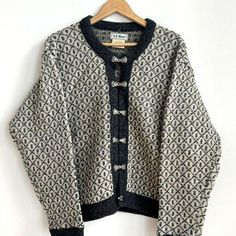 This L.L Bean cardigan sweater is a must-have for any woman's wardrobe. The ivory grey beige color is perfect for any occasion. It features long sleeves and is made of high-quality wool, ensuring both warmth and comfort.  The sweater is designed in a Nordic style, giving it a unique and elegant look.   The sweater is available in a size M and is perfect for regular size types. It is a women's department item and is suitable for any woman's clothing needs. The cardigan style is perfect for layering and can be worn with a variety of outfits. Chest: 48" Vintage Gray Sweater For Fall, Vintage Beige Winter Cardigan, Gray Vintage Sweater For Fall, Vintage Cream Cardigan For Winter, Beige Long Sleeve Cardigan With Fair Isle Pattern, Classic Long Sleeve Cardigan With Fair Isle Pattern, Winter Vintage Cream Cardigan, Beige Fair Isle Long Sleeve Cardigan, Beige Long Sleeve Fair Isle Cardigan