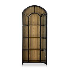 an arched glass display cabinet with wooden shelves