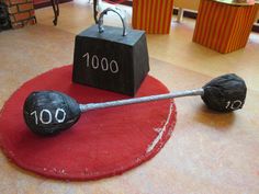 two black bags with numbers on them sitting on top of a red rug next to each other