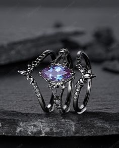 Rhodium black engagement ring like no other. This AMAZING piece of fine jewelry is the perfect expression of your eternal love. Its BLACK colors bring out the beauty of this ring. Alexandrite is the gemstone of luck, prosperity, and intellect. The alexandrite gemstone shines different colors in different lights. Under white light it shines more green and shines purple and blue under yellow light and daylight. More black gold rings ,please click here: https://www.etsy.com/shop/ShainGem?section_id Alexandrite Ring And Black, Gothic Open Ring For Anniversary, Gothic Party Ring Jewelry, Gothic Party Ring, Gothic Open Ring Jewelry For Anniversary, Gothic Black Crystal Promise Ring, Gothic Black Promise Rings, Gothic Oval Wedding Ring, Gothic Promise Ring Jewelry