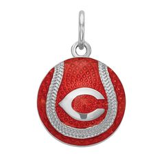 a red and white charm with the letter c on it's center, surrounded by diamonds