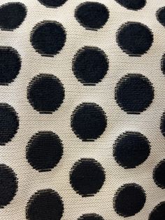 a black and white polka dot pattern on fabric