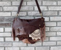 This bohemian bag is made of genuine  leather in dark brown. I use fringe details And you can pull out the fringe because they are attached with snap buttons.  The crochet is handmade. Large size. Closure is zipper. There are 1 zippered pocket inside and lined cotton fabric. Its  inner width is 37 and height is 27 cm. Thickness is 7 cm. (14.5'' x10.7'' x 2.8'' ) Strap is adjustable. Please note that color may vary according to monitor color calibrations. If you have any question, please don't he Brown Hand-stitched Tote Shoulder Bag, Bohemian Fringe Satchel For Daily Use, Bohemian Brown Shoulder Bag For Festival, Bohemian Brown Shoulder Bag, Brown Hobo Crochet Bag For Everyday, Hippie Handmade Brown Shoulder Bag, Brown Artisan Shoulder Bag For Festivals, Hippie Brown Handmade Shoulder Bag, Handmade Bohemian Leather Shoulder Bag