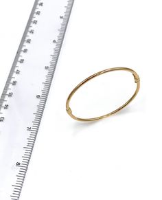 14K Yellow Gold Plain Baby Bangle. Adjustable 14k Gold Bangle, Fine Jewelry, Classic Adjustable Hoop Bracelets, Yellow Gold Bangle Bracelet With Spring Ring Clasp, Yellow Gold Hinged Bracelet, Yellow Gold Hinged Round Bracelet, Hinged 14k Gold Round Bracelets, Hinged Yellow Gold Round Cuff Bracelet, Adjustable Yellow Gold Flexible Bangle, Adjustable Flexible Yellow Gold Bangle