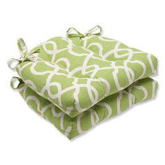 two green and white pillows stacked on top of each other