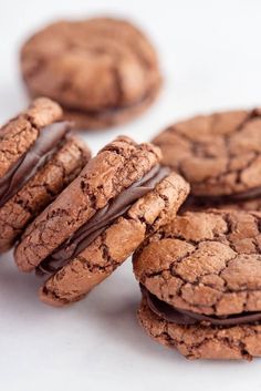 cookies with chocolate frosting stacked on top of each other