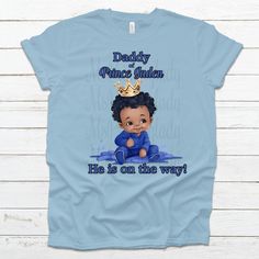 Baby Boy Blue Baby Shower Prince (or Baby) Custom Name On Shirts! Choose Shirt Color and Font Color. High-Quality Prints and Service These personalized Prince Shirts are adorable and will leave a lasting memory.  Pick name title in the listing options. If you would like additional names, contact me for additional payment options.   State the name of the coming prince, Shirt Color and family title in the box.  Please note: We will attempt to have the same brand for all of the shirts, however the supply shortage will  allow for different shirts to have different brands. We ONLY use premium SOFT SHIRTS! Cute Blue Shirt For Birthday, Family Matching Blue Shirt With Letter Print, Blue Pre-shrunk Family Matching Shirt, Family Matching Blue Shirt, Casual Blue Shirt For Gender Reveal, Family Matching Blue Pre-shrunk Shirt, Blue Short Sleeve Tops For Gender Reveal, Blue Family Matching Shirt With Letter Print, Family Matching Blue Shirt For Birthday