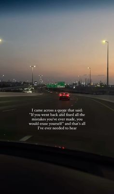 a car driving down a highway at night with a quote on the front and back