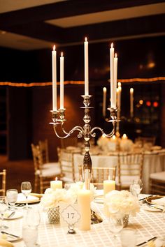 the centerpieces on this table are all lit up and ready to be eaten