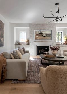 a living room filled with furniture and a fire place