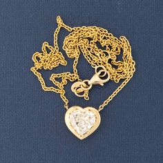 This reclaimed heart shape diamond, now set in this chunky yellow gold bezel is only the most charming pendant ever! The diamond is a spready "fat" heart, with delicious broad facets. Beyond charming, sitting nice and low on the neck. 18kt yellow gold Chain measures 18" Diamond is estimated to be O/P color & VS2 clarity. GIA Standards Please see qualitative report for more information. Luxury Heart-shaped Jewelry With Bezel Setting, Gold Heart Jewelry With Bezel Setting, Gold Heart Pendant With Bezel Setting, Gold Heart Pendant Jewelry With Bezel Setting, Gold Heart Necklace With Single Cut Diamonds For Gift, Gold Heart Necklace With Single Cut Diamonds, Gold Heart Necklace With Single Diamond, Yellow Gold Heart-shaped Rose Cut Diamond Jewelry, Yellow Gold Heart-shaped Jewelry With Rose Cut Diamonds