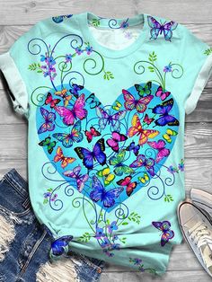 Butterfly Print Crew Neck T-shirt Blue Butterfly Print T-shirt For Summer, Blue Butterfly Print T-shirt For Spring, Cute Butterfly Print T-shirt For Spring, Blue Butterfly Print Short Sleeve T-shirt, Cute Summer T-shirt With Butterfly Print, Blue Short Sleeve T-shirt With Butterfly Print, Blue Crew Neck Top With Butterfly Print, Blue Top With Butterfly Print And Crew Neck, Multicolor Butterfly Print Top For Summer