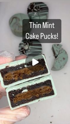 two pieces of cake that are in someone's hand with the words thin mint cake pucks