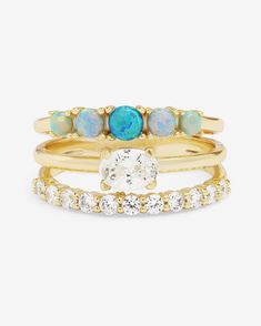 The She's So Stacked Ring is your secret to a stacked look with zero effort. This single ring gives you the layered allure of three perfectly aligned bands, all fused together for a flawless fit. Bands of sparkling simulated diamonds and simulated ombré blue opals come together to create a statement piece that's as easy to wear as it is stunning. It's the perfect shortcut to looking like you've got your life (and your rings) together-no stacking required. DETAILS: Stacked Ring Stone Count: (11) Stackable Opal Ring Jewelry, Blue 14k Gold Stackable Rings, Luxury Stackable Opal Ring, Blue Turquoise Stackable Open Ring, Adjustable Opal Stackable Rings, Blue Ombre, Blue Opal, Stacking Rings, Statement Pieces