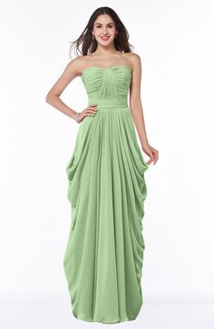 a woman in a strapless green dress