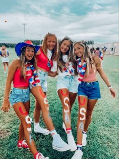 the girls are all wearing red, white and blue