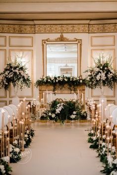 an elegant ceremony setup with white flowers and greenery