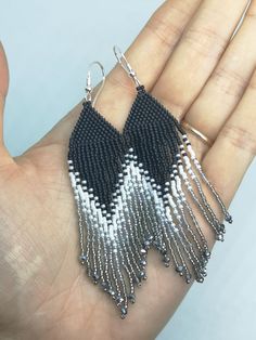 Elegant and fashionable fringe earrings. They are made in brick stitch bead weaving technique and loose fringes of qualitative Japanese Toho 15/0 glass seed beads. The size of the earrings approx. 9.5cm (3.74inch) long from the top of the earwire and 2cm(0.8inch) wide. There are used 925 sterling silver earring hooks and each earring is stamped 925. Item will be shipped carefully packed! I ship worldwide via Priority mail (Latvijas Pasts) from Latvia (EU). All orders have a tracking number and a Black And White Fringe Earrings, Silver Jewelry With Fringe And Round Beads, Silver Fringe Beaded Earrings For Gift, Silver Beaded Fringe Earrings For Gift, Silver Beaded Fringe Tassel Drop Earrings, Silver Fringe Beaded Earrings With Round Beads, Silver Beaded Earrings With Fringe And Round Beads, Silver Handwoven Dangle Jewelry, White Brick