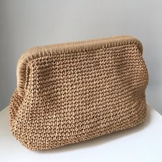 this grab bag will be indispensable this summer! Casual Beige Clutch For Beach, Woven Clutch Bag For Beach, Woven Clutch Bag For The Beach, Beige Summer Straw Clutch Bag, Summer Beige Straw Clutch Bag, Woven Beige Straw Clutch Bag, Beige Woven Straw Clutch Bag, Beige Rectangular Beach Clutch, Beige Woven Pouch Straw Bag