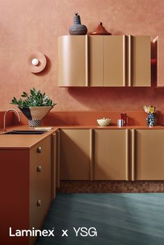 an image of a kitchen setting with orange walls