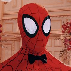 the spider man is wearing a bow tie