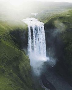 an aerial view of a waterfall in iceland