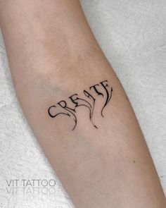 a woman's arm with the word breathe tattooed on it