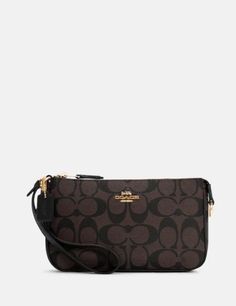 the coach wrist bag in brown and black