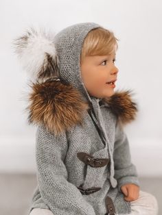 Petite Maison Kids. Made from highest quality materials. 100% Cashmere Knit Hat with two large Fox Fur Poms. Poms are detachable for easy washing. Please remove them prior to washing. Hand Wash and lay flat to dry. Dry Clean Recommended. Hat provides excellent neck and ear coverage with under chin ties. Winter Soft Knit Cashmere Outerwear, Gray Cashmere Outerwear For Winter, Gray Merino Wool Outerwear For Winter, Winter Merino Wool Soft Knit Outerwear, Luxury Gift Set, Blanket Shawl, Cashmere Beanie, Honeycomb Design, Outfits With Hats