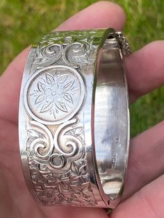 Superb Hallmarked solid silver Victorian cuff bracelet with etched Ivy design by Joseph Whitten Birmingham 1883. It has a width of 2.5cm. The Internal Measurement is 6cm by 4.8. It remains in excellent condition a couple of very light indents on the back really not worth mentioning.