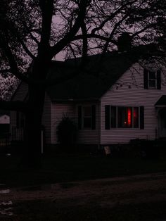 a white house with red lights in the windows