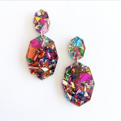 pair of colorful earrings on white background