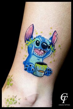 a small tattoo on the foot of a person's leg with an image of stitching