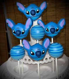 there are some blue cake pops with ears on them