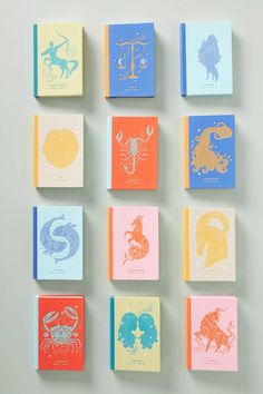 nine different colored cards with zodiac symbols on them